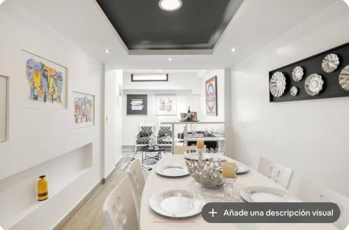 a dining room with a table and chairs at Vita House in Quito