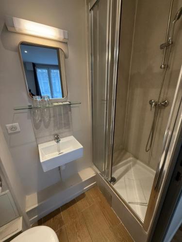 a bathroom with a shower and a sink at LAFAYETTE HOTEL in Paris