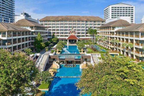 an aerial view of a resort with a swimming pool at The Heritage Pattaya Beachfront Resort in Pattaya South