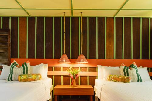 Llit o llits en una habitació de Mawamba Lodge