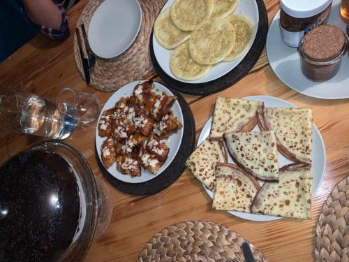 a table with plates of food on top at Villa Serenity Marrakech in Châba