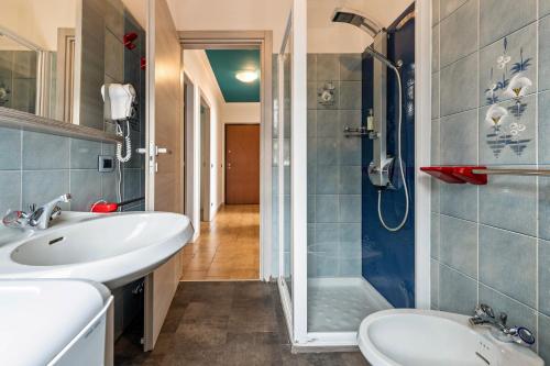 a bathroom with a sink and a shower at Casa Tuly 1 in Brenzone sul Garda