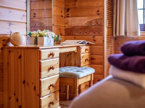 a bedroom with a dresser and a desk with a chair at 1 Bed in Clovelly 00355 in Clovelly
