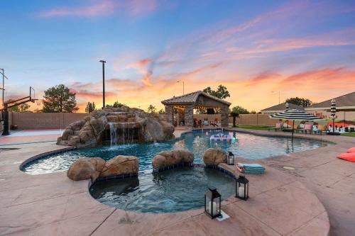 a pool in a park with a water slide at Luxury 6BR Retreat - Pool BBQ Theater and Games in Lemontree