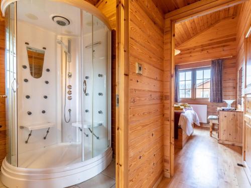 a shower in a room with wooden walls at 2 Bed in Clovelly 00362 in Clovelly