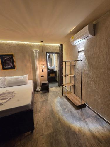 a bedroom with a bed and a room with a mirror at Fm Luxury villa viscaya Mini Playa y piscina privada in Nilo