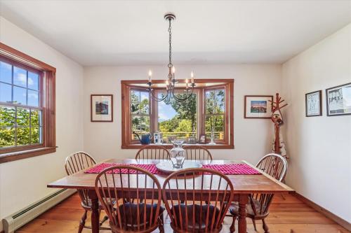 a dining room with a table and chairs at Ayers Farm Cottage in Stowe