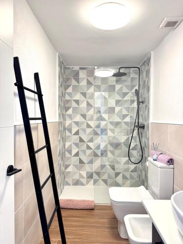 a bathroom with a shower and a toilet and sink at Casa Morena in Costa de Antigua