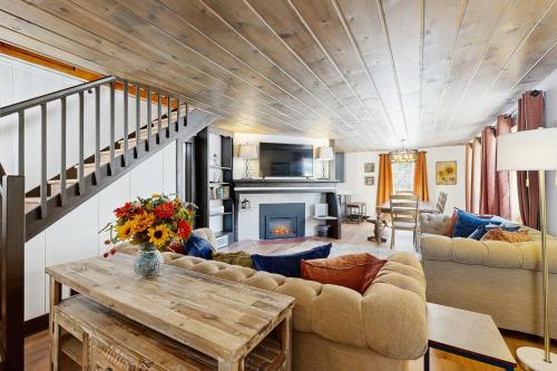 a living room with a couch and a table at Brighton Sunflower Chalet in Brighton