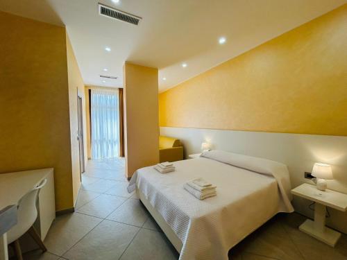 Ένα ή περισσότερα κρεβάτια σε δωμάτιο στο Nuovo Borgo B&B