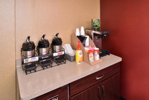 a counter in a hotel room with pots and pans at Red Roof Inn Milwaukee Airport Oak Creek in Oak Creek