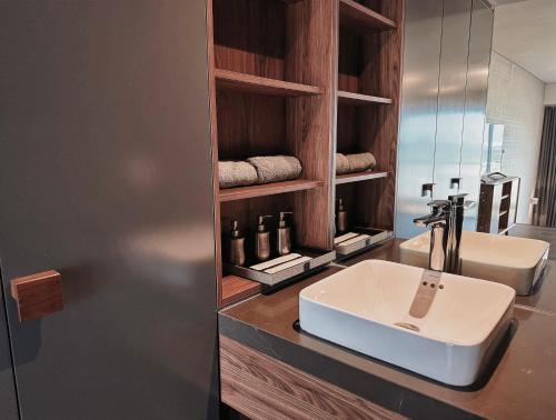 a bathroom with a sink and a mirror at Westlake view condominium in Hanoi