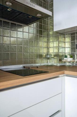 a kitchen with a stove top oven in a kitchen at CITY Loft Lux in Thessaloniki