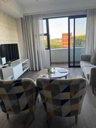 TV a/nebo společenská místnost v ubytování 214 Executive Suite,