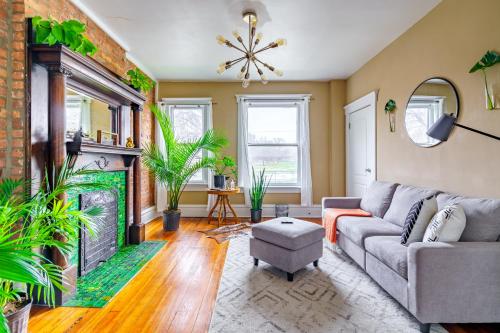 a living room with a couch and a fireplace at Prime Location Top Rated Free Parking Clean in Columbus