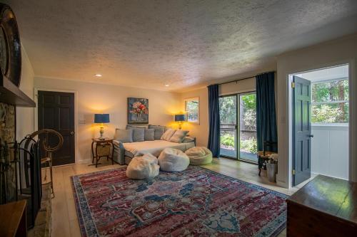 a living room with a couch and a rug at Elk Watch at Hound Ears in Valle Crucis