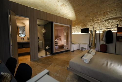 a large room with a bed and a bathroom at Myra Bari Bed & Spa in Bari