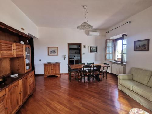 a living room with a couch and a table at La Terrazza di Maria in Pienza