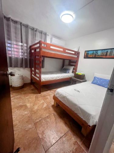 a bedroom with two bunk beds in a room at Daisy'Hause 2 to 6 people, ideal for your family in Carolina