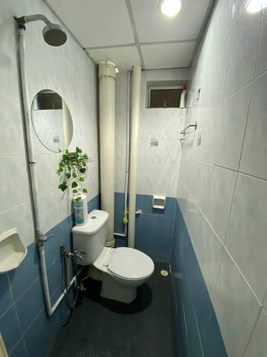 a small bathroom with a toilet and a sink at Budget Friendly 3Bedroom Walkable to USM in Gelugor