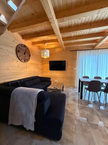 a living room with a couch and a table at Beskidzkie Wyspy in Tenczyn