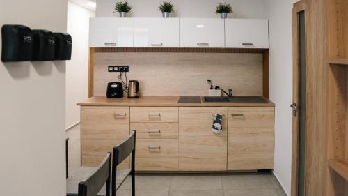 a small kitchen with a sink and a counter at Star house Sereď in Seredʼ