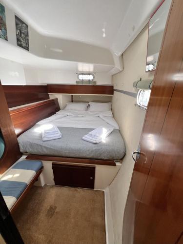 a small bed in the back of a boat at Catamaran Corto Maltese III in Lisbon