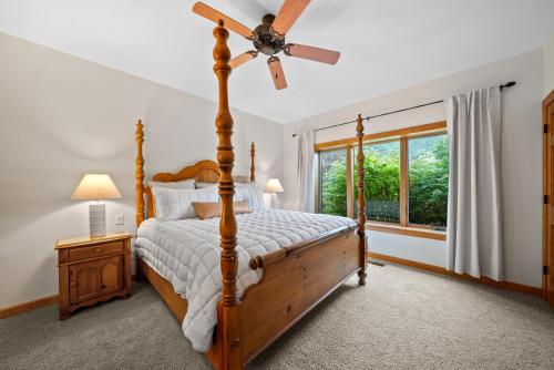 a bedroom with a bed and a ceiling fan at Chetola: Sierra 1 in Blowing Rock