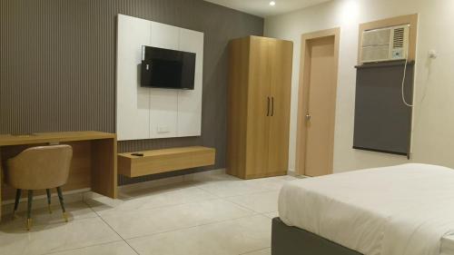 Μια τηλεόραση ή/και κέντρο ψυχαγωγίας στο Miran Hotel & Suites - Mathura Road Faridabad