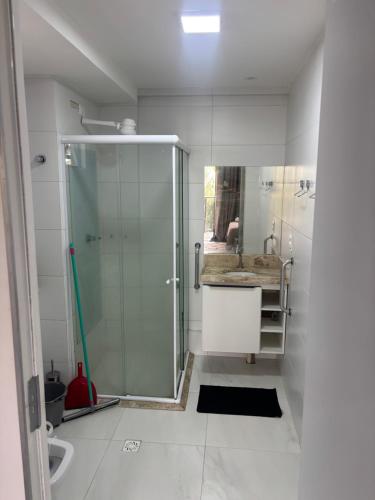 a bathroom with a shower and a sink at Flat luxo Tambaú in João Pessoa