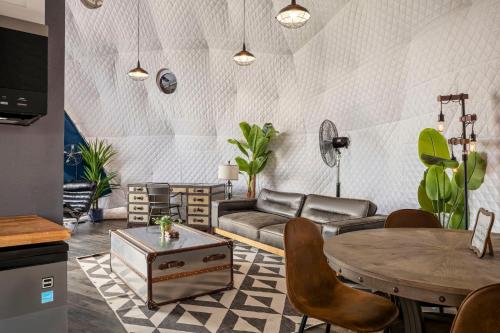 a living room with a couch and a table at Luxury Glamping Dome on Texas Farm in San Marcos