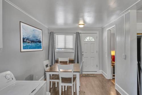 a kitchen and dining room with a table and chairs at The Main Lineup 2 - All Star Baseball Rentals in Oneonta