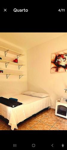 Ένα ή περισσότερα κρεβάτια σε δωμάτιο στο Casarão Lima Duarte