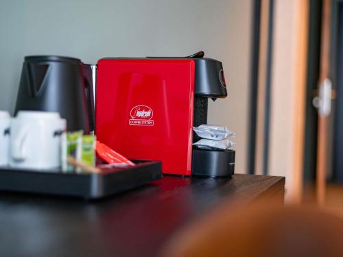 a red box sitting on top of a table at Hotel Valkenburg by Mercure - Next to Shimano Experience Center in Valkenburg