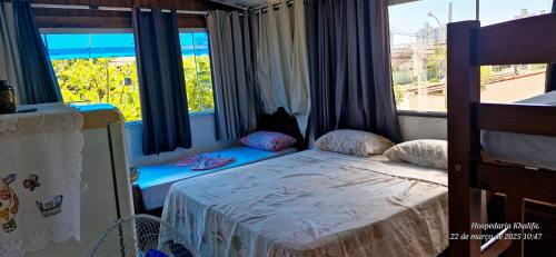 Giường trong phòng chung tại Refúgio do Khalifa