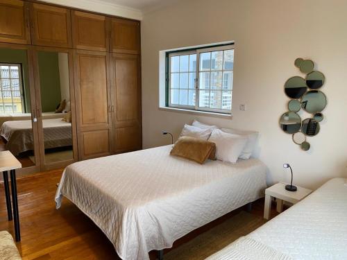 En eller flere senge i et værelse på Refúgio de Famões