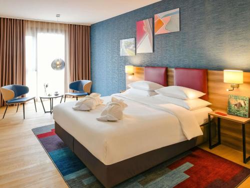 Postel nebo postele na pokoji v ubytování Mercure Geneva Airport