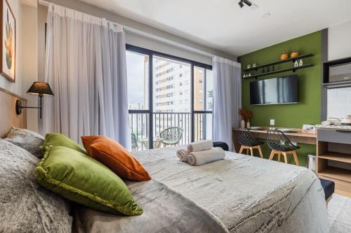 Ένα ή περισσότερα κρεβάτια σε δωμάτιο στο Sᴛᴜᴅɪᴏs Smart Bourbon - Completíssimo e novíssimo!