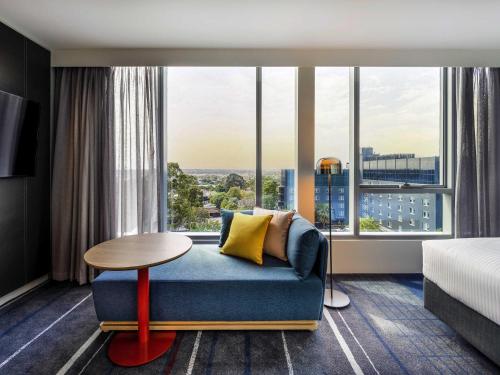 Zona de estar de Novotel Melbourne Preston