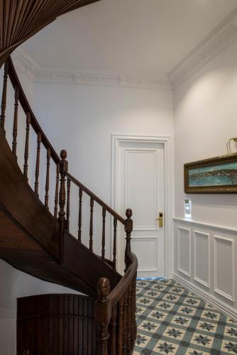 a staircase in a white room with a door at Rodosto Hotel in Tekirdag