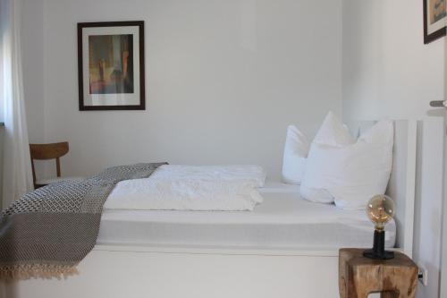 Ένα ή περισσότερα κρεβάτια σε δωμάτιο στο Ferienwohnung Ferdinand