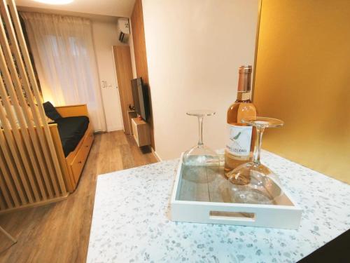 a bottle of wine sitting on top of a counter at Joli studio à Aix-en-Provence in Aix-en-Provence