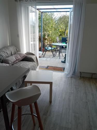 a living room with a couch and a table at Annaswood Self Catering in Ballylooby