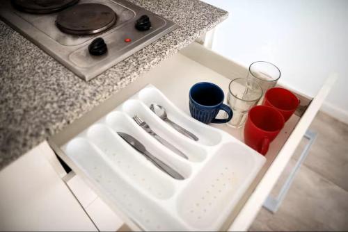 a white tray sitting on top of a kitchen counter at departament en Añelo Neuquen in Añelo