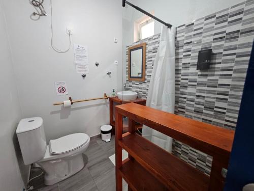 a bathroom with a toilet and a sink and a shower at kasa Tambla in Ponta do Sol