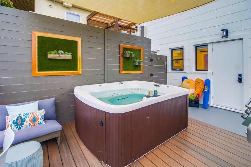 a jacuzzi tub in the middle of a room at Lux Escape 1: Views Hot Tub Games Safari Tent in San Diego