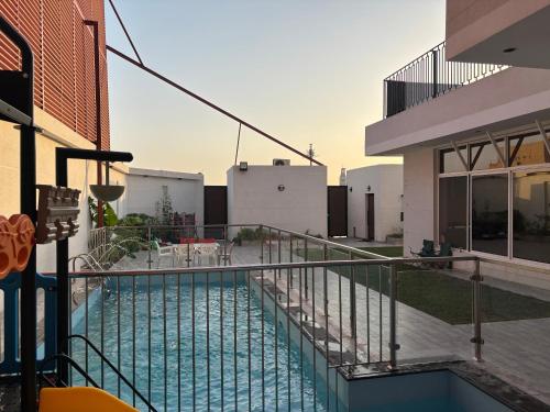 a swimming pool on the balcony of a building at استراحة غريس الجديدة in Jeddah