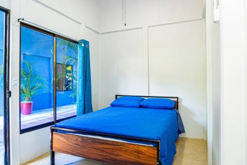 Ένα ή περισσότερα κρεβάτια σε δωμάτιο στο Deer Apartments Bahía Ballena