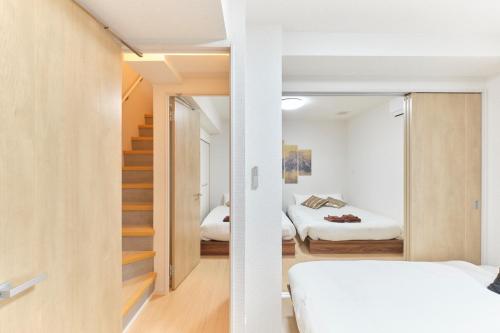 Postel nebo postele na pokoji v ubytování J-ARC Akebonobashi - Vacation STAY 17364