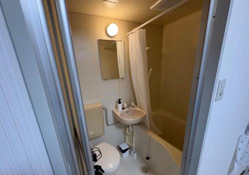 a small bathroom with a sink and a toilet at Silver Heights 3rd floor 302,303,304 - Vacation STAY 60263v in Osaka